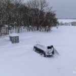 雪に埋もれていく駐車場